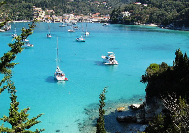 Yachts at the pier at Port Lakka on Paxos Island. Ionian Islands. Greece.