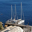 Yacht mooring at the pier of Oia village