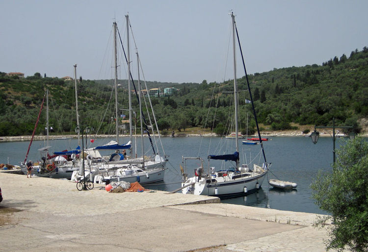 Yacht mooring at the pier of Port Ateni on Meganisi Island. Ionian Sea. Greece.