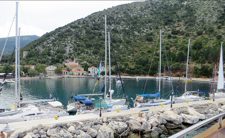 Yachts at the breakwater in the port of Frikes. Ithaca Island. Ionian Sea. Greece.