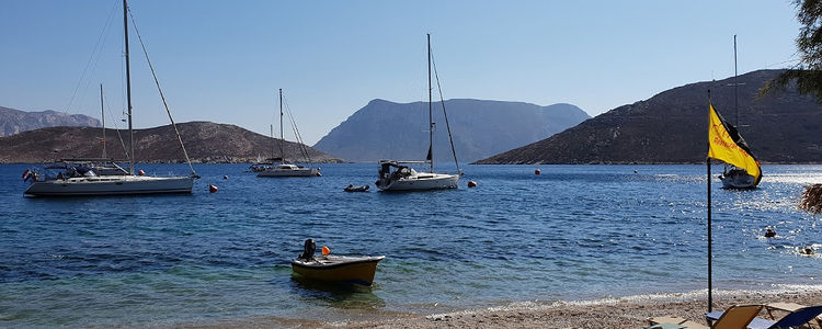 Yacht mooring on buoys in Emborios Bay