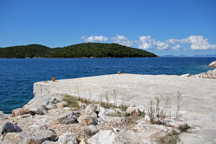 Mooring for one yacht along on the outer side of the breakwater of Murtos Marina. Ionian Sea. Greece.