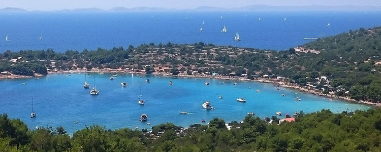 Yacht mooring on buoys and anchors in Kosirina Bay