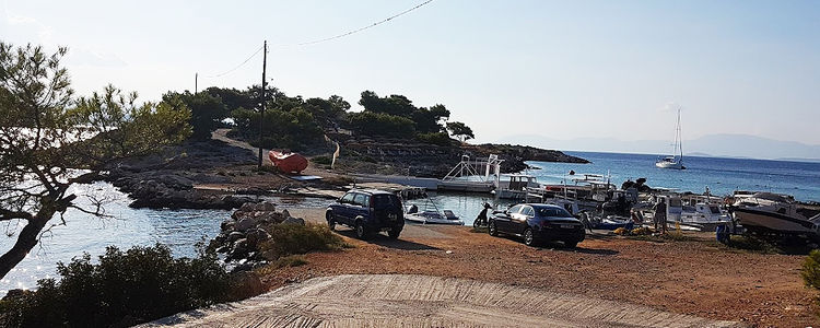 A yacht at anchor off Aponiso islet