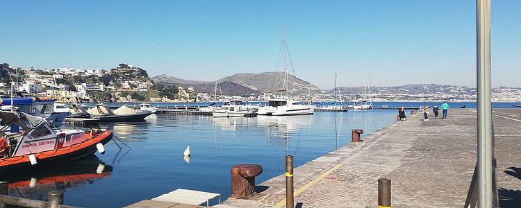 Yacht moorings in Baia harbor