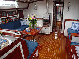 Main Saloon with White tiled woodburning stove