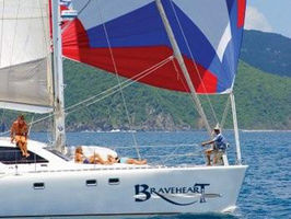 Guests enjoying a relaxing and colorful ride under spinnaker