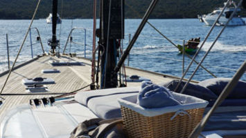 Disco at anchor, guests on banana in background