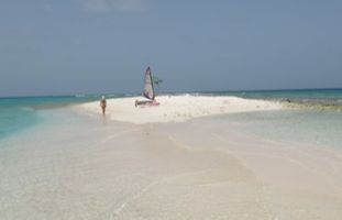 Sailing Dinghy Merlin on the beach