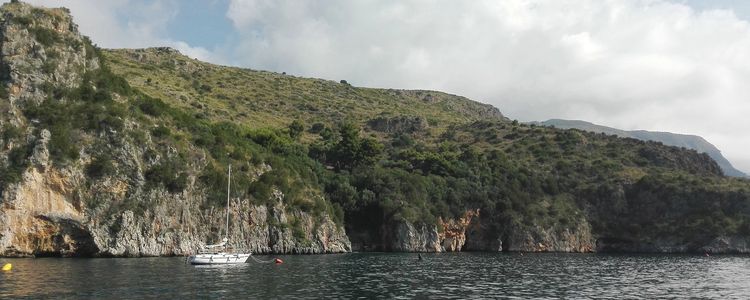 Yacht mooring on buoys in Infreschi Bay