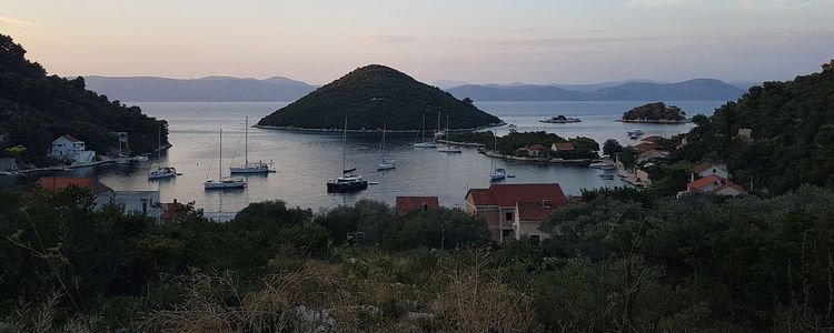 Mooring of yachts on buoys in Prozura Bay on the NE coast of Mljet Island. Croatia