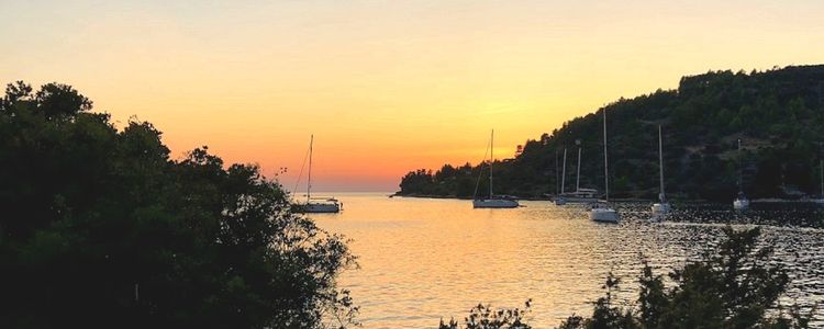 Yacht mooring on the buoys in Plitvine Bay