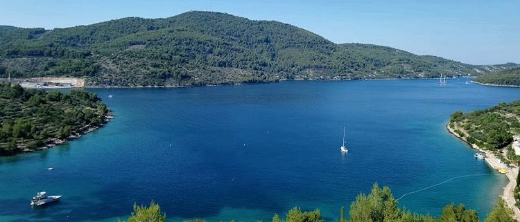 Yacht mooring on the buoys in Plitvine Bay