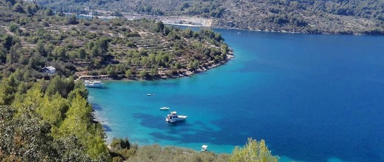 Yacht mooring on the buoys in Plitvine Bay