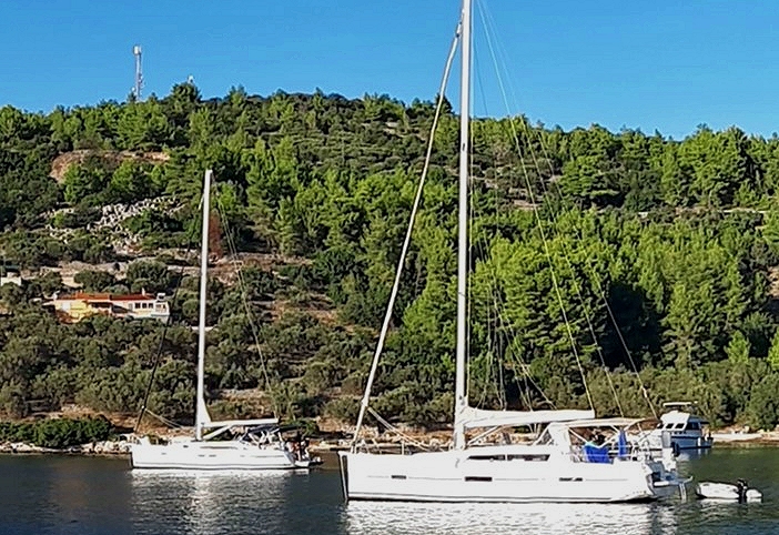 Yacht mooring on the buoys in Plitvine Bay