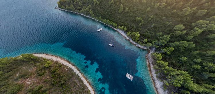 Yacht mooring at the buoys in Manastir Bay