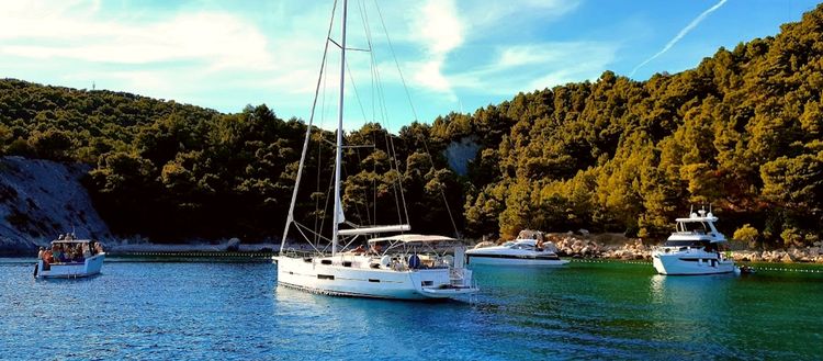 Yacht mooring on buoys in Velo Borca Bay