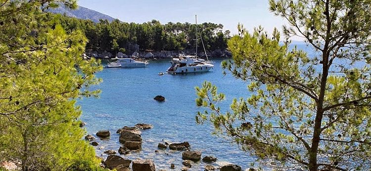 Yacht mooring on buoys in Velo Borca Bay