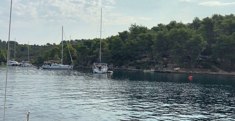 Yacht mooring on buoys in Zavala Bay