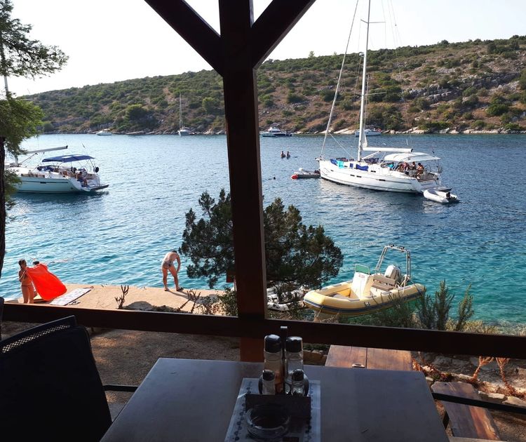 Yacht mooring on buoys in Zavala Bay