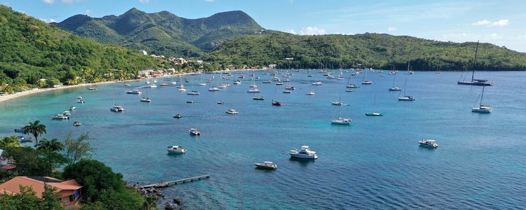 Yachts on anchors and buoys in Grande Arlets Bay