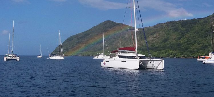 Yachts on anchors and buoys in Grande Arlets Bay