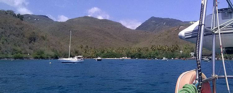 Yacht moorings on buoys and anchors in Barque Bay (Anse a la Barque)