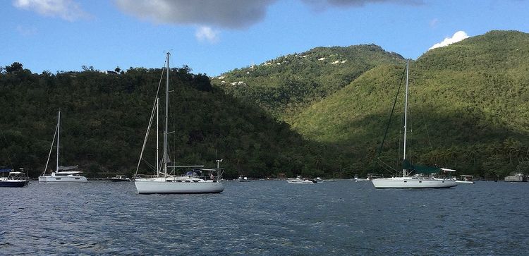 Yacht moorings on buoys and anchors in Barque Bay (Anse a la Barque)