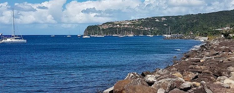 Yacht mooring on buoys and anchors in Malendure Bay