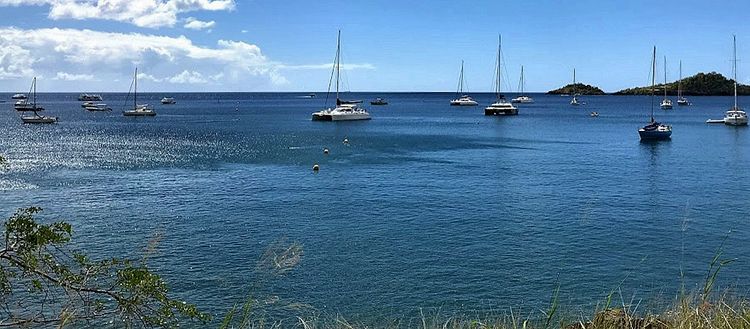 Yacht mooring on buoys and anchors in Malendure Bay