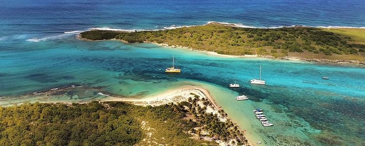 Yacht mooring on the buoys in the Petite Terre Reserve