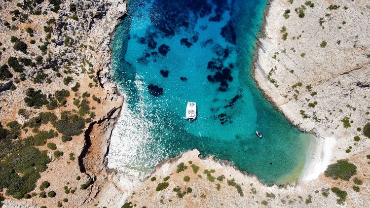 Yacht mooring in the Yaloudia cove