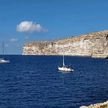 Yacht mooring at buoys in Xlendi Bay