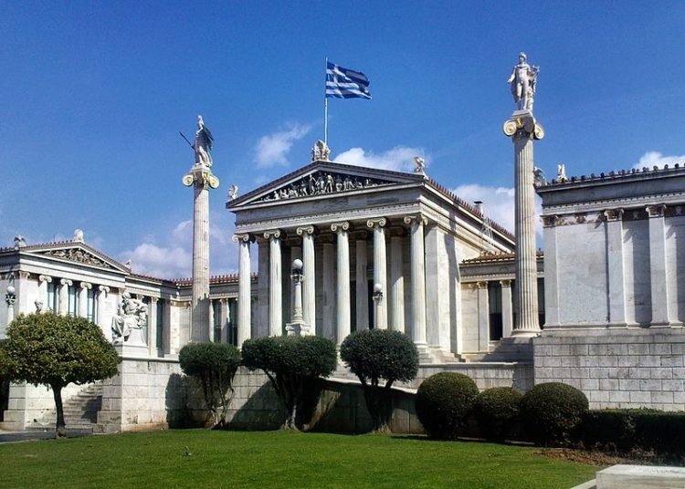 Statues of the ancient Greek gods Athena and Apollo in front of the Athens Academy of Sciences