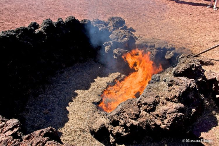 Dry grass bursting with volcanic heat.