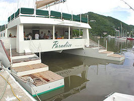 The main salon opens to a spacious and shaded aft teak deck with dining and a full bar.